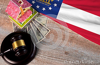 Property auction, flag Georgia, gavel wooden and model house on wooden background, lawyer of home real estate Stock Photo