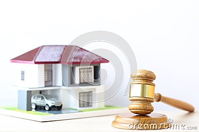 Property auction, Gavel wooden and model house on wtite background, lawyer of home real estate and ownership property concept Stock Photo