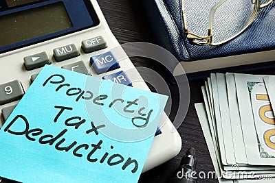 Property tax deduction written on a label. Stock Photo