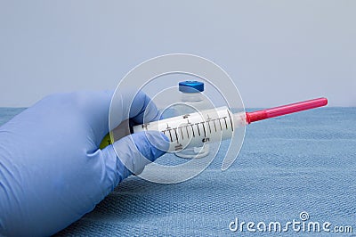 Propofol Syringe in Left Hand Stock Photo