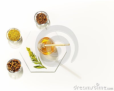 Propolis and honey in glass jars on a white background with copy space Stock Photo