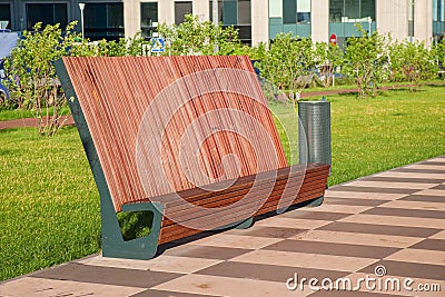 Proportion, practicality, and sturdy construction of modern urban street hardwood furniture. Stock Photo