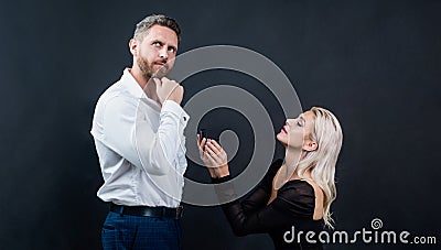 proposal of marriage. woman on knee with engagement ring in front of man. marry me. love romantic date. happy valentines Stock Photo