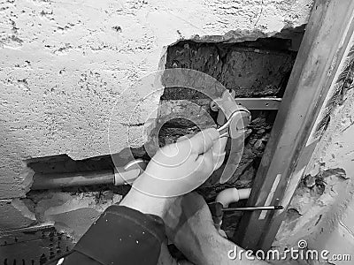 Propylene pipe and gates in a brick wall - propylene welding Stock Photo