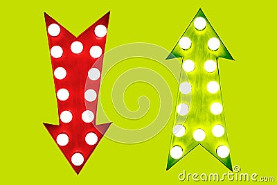 Pros and cons red down and green up vintage retro arrows illuminated with light bulbs on green background Stock Photo