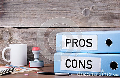 Pros and Cons. Two binders on desk in the office. Business background Stock Photo