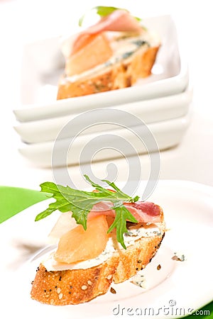 Prosciutto and blue cheese canapes Stock Photo