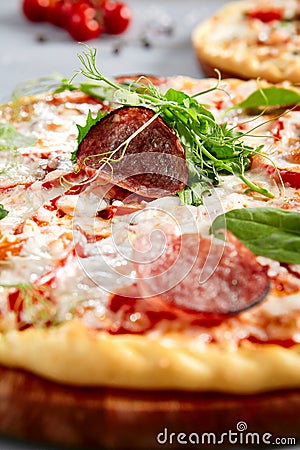 Prosciutto Funghi pizza on wooden board Stock Photo