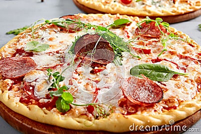 Prosciutto Funghi pizza on wooden board Stock Photo