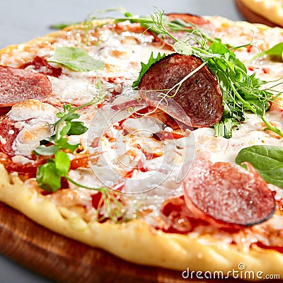 Prosciutto Funghi pizza on wooden board Stock Photo