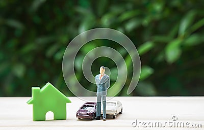 Prosperity concept successful businessman with house and luxury cars Stock Photo