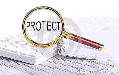 PROTECT word through magnifying glass on keyboard on the chart Stock Photo