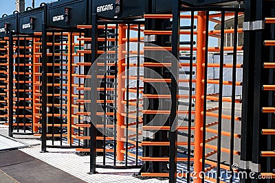 Protected entrance gate / secured turnstiles outdoors at stadium Stock Photo