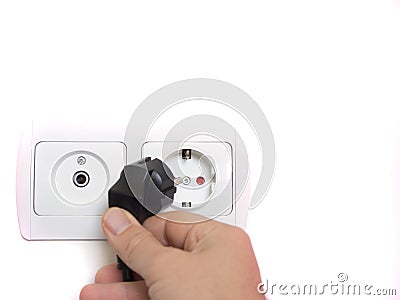Protected grounded electrical outlet on the wall and antenna socket Stock Photo