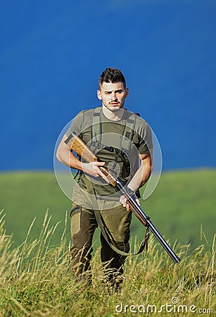 Protecting borders of motherland. Stop illegal immigrants. Man with weapon military clothes in field nature background Stock Photo