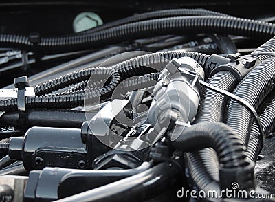 Protection hoses, pressure tubes and binding corrugated cables in engine wires arrangement Stock Photo