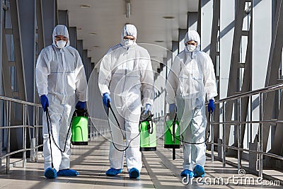 Protection measures by specialists in coronavirus hazmat suits Stock Photo