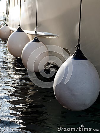 Protection of a side of a boat in the port Stock Photo