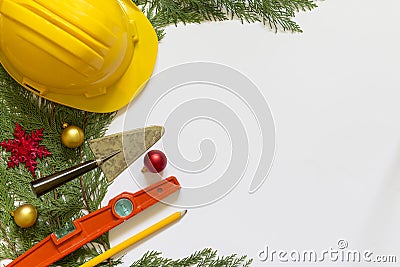 Protective helmet, mason tools and Christmas decorations on white background Stock Photo