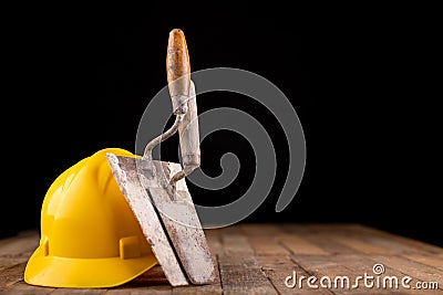 Protective helmet and tools for bricklayer. Work accessories for production workers Stock Photo