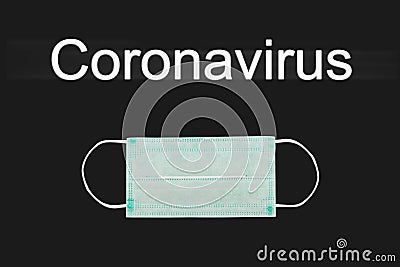 Protective medical face mask on a black background. Concept for news, picture for articles with the inscription coronovirus. Stock Photo