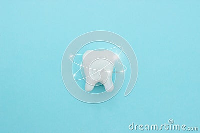 Protective vortex around tooth model on blue , teeth will good healthy Stock Photo