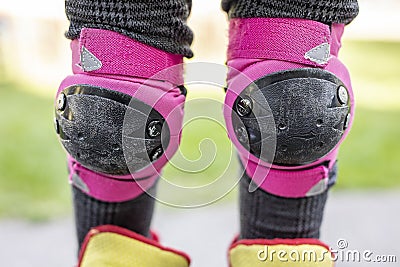 Protectors on teenage girl skateboard knee Stock Photo