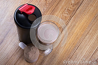 Protein shake, shaker and round scoop Stock Photo