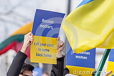 Protest against Russia`s invasion of Ukraine. Anti-war protest. People holding posters of supporting Ukraine Editorial Stock Photo