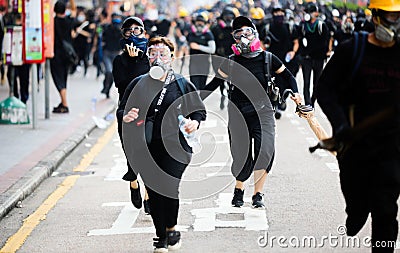 Protest hong kong police running against protester Editorial Stock Photo