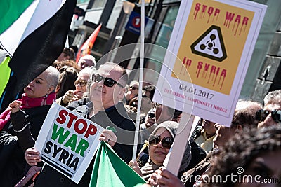 Protest signs against the war in Syria at demonstration Editorial Stock Photo