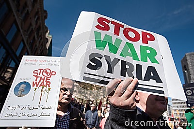 Protest signs against the war in Syria at demonstration Editorial Stock Photo