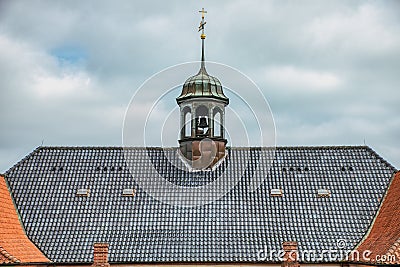 Protestant lutheran church pitched roof facade with a bell tower in the middle convey religious concept. Copenhagen, Denmark Stock Photo