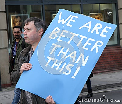 A Protester Holds an Optimistic Sign At an Anti-Trump Rally Editorial Stock Photo