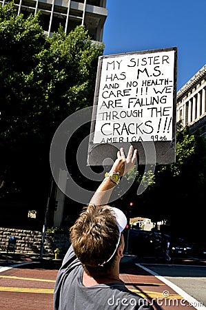 Protester Holds Up Sign at Occupy L.A. Editorial Stock Photo