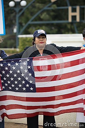 Protester holds USA Flag at the Defend Dreamers Rally Editorial Stock Photo