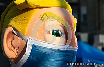 Protester Wearing a Large Masked Donald Trump Costume at the Milwaukee Republican Presidential Debate Editorial Stock Photo