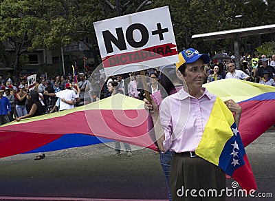 Protesters against Nicolas Maduro dictatorship march in support of Guaido Editorial Stock Photo