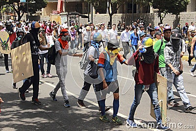 Protesters in Caracas Venezuela displaying anti teargas masks Editorial Stock Photo
