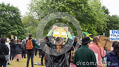EXETER, DEVON, UK - June 06 2020: Protesters hold signs at a Black Lives Matter demonstration Editorial Stock Photo