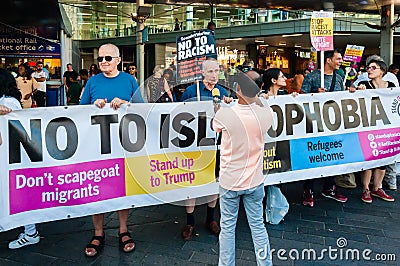 Protesters holding placards & posters at the March Against Racism demonstration of the dramatic rise of acid race related attacks Editorial Stock Photo