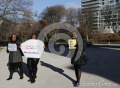 Protesters march against police brutality and grand jury decision on Eric Garner case on Grand Army Plaza in Brooklyn Editorial Stock Photo