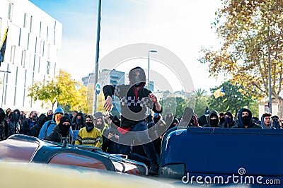 Barcelona, Spain - 21 decemer 2018: young catalan independists, called Cdr, clash with police during a cabinet meeting in Llotja Editorial Stock Photo