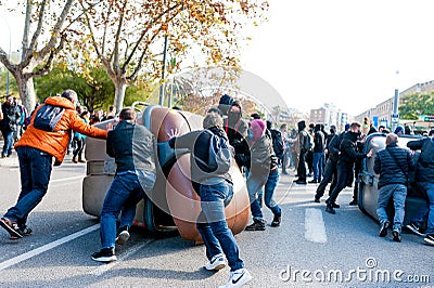 Barcelona, Spain - 21 decemer 2018: young catalan independists, called Cdr, clash with police during a cabinet meeting in Llotja Editorial Stock Photo