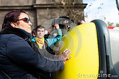 Barcelona, Spain - 21 decemer 2018:old woman blocking catalan independists, called Cdr, clash with police during a cabinet Editorial Stock Photo