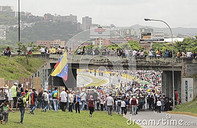 Protesters participating in the event called The mother of all protests in Venezuela against Nicolas Maduro government 2017 Editorial Stock Photo