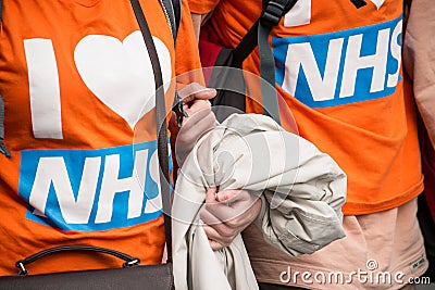 Protesters wearing I love NHS t-shirts at the Save Our NHS protest demonstration - London. Editorial Stock Photo