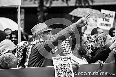 Washington, DC - 10-14-2023: Protestor holding peace sign at Palestine march Editorial Stock Photo