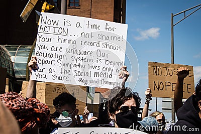 Protestors March and Hold Up Signs for Justice for George Floyd Editorial Stock Photo