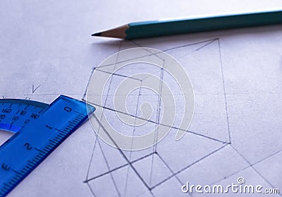 A protractor, pencil, and eraser lie on white paper with a drawn drawing. Stock Photo